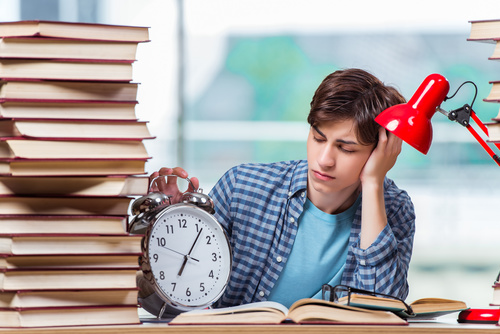 Boy overtime learning Stock Photo