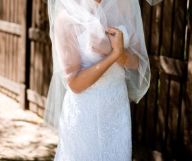 Bride in white wedding dress standing Stock Photo 02