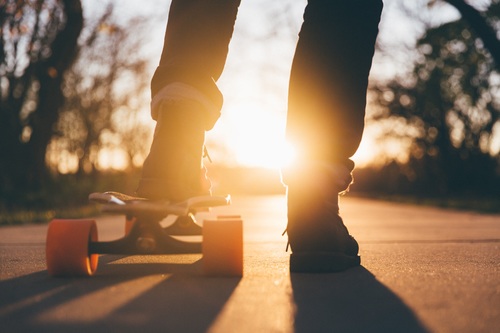 Close-up feet and skateboard Stock Photo