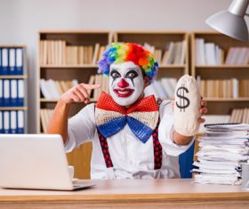 Clown in the office Stock Photo 01