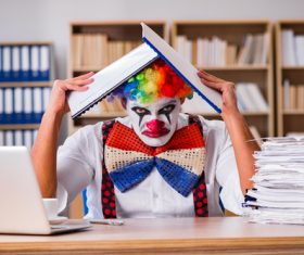 Clown in the office Stock Photo 02