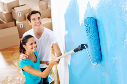 Couple new home paint Stock Photo