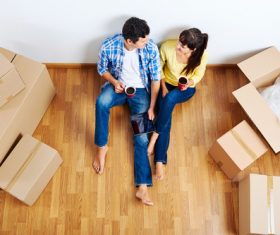 Couple sitting in new home resting Stock Photo