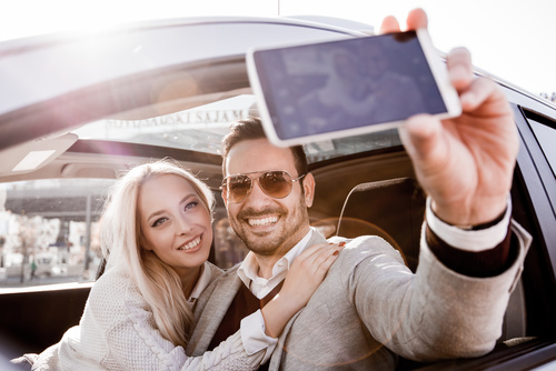 Couple sitting in the car selfie Stock Photo