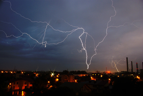 Cumulonimbus and lightning over the city Stock Photo 01