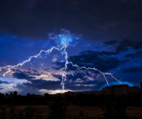 Cumulonimbus and lightning over the city Stock Photo 03