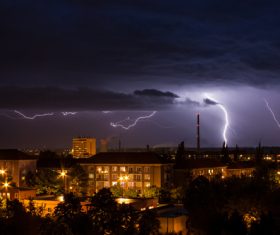 Cumulonimbus and lightning over the city Stock Photo 04