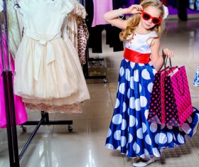 Cute little girl posing in the mall Stock Photo