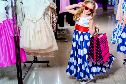 Cute little girl posing in the mall Stock Photo
