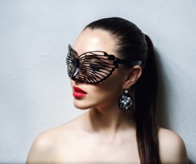 Cute woman wearing black butterfly mask Stock Photo 02