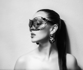Cute woman wearing black butterfly mask Stock Photo 03