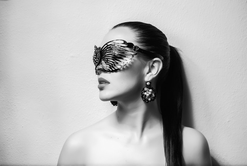 Cute woman wearing black butterfly mask Stock Photo 03