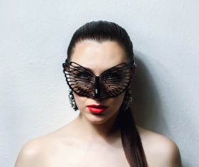 Cute woman wearing black butterfly mask Stock Photo 04