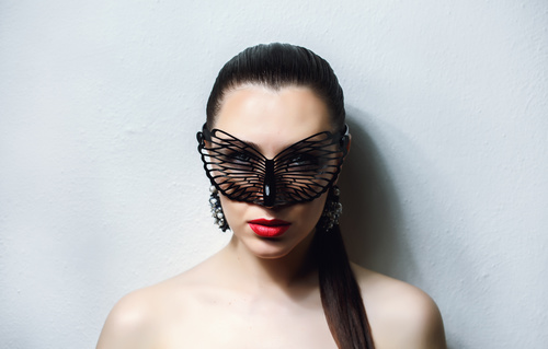 Cute woman wearing black butterfly mask Stock Photo 04