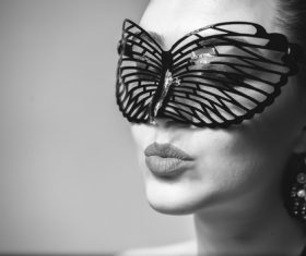 Cute woman wearing black butterfly mask Stock Photo 05