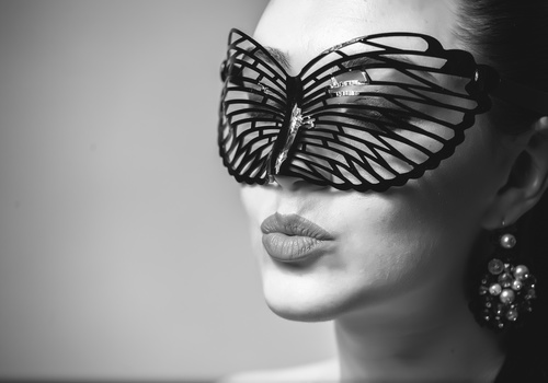 Cute woman wearing black butterfly mask Stock Photo 05