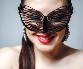 Cute woman wearing black butterfly mask Stock Photo 06