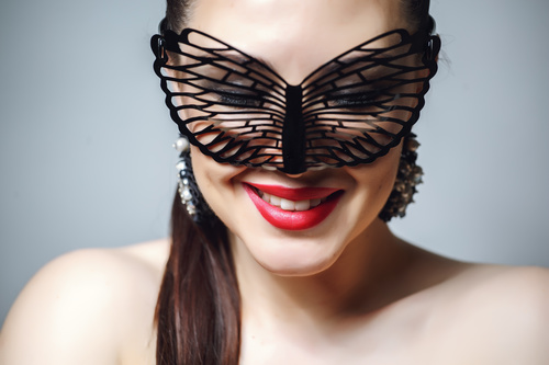 Cute woman wearing black butterfly mask Stock Photo 06