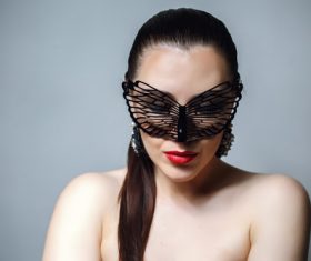 Cute woman wearing black butterfly mask Stock Photo 10
