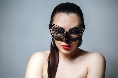 Cute woman wearing black butterfly mask Stock Photo 10