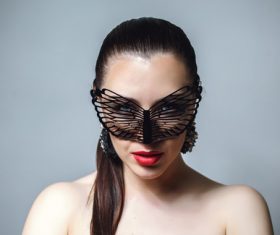 Cute woman wearing black butterfly mask Stock Photo 11
