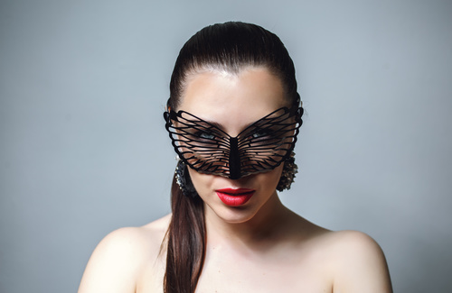 Cute woman wearing black butterfly mask Stock Photo 11
