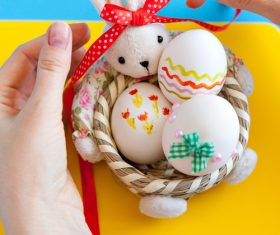 Decorative basket and easter eggs Stock Photo