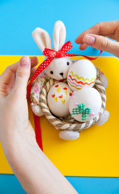 Decorative basket and easter eggs Stock Photo
