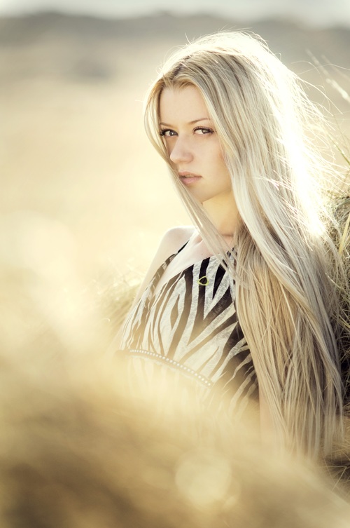 Elegant shawl blonde girl backlight photography Stock Photo