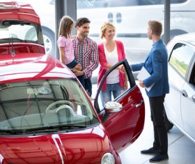 Family buying new car Stock Photo