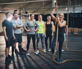 Female coach guiding the basics of climbing rope Stock Photo 01
