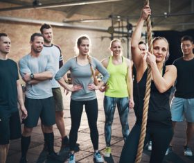 Female coach guiding the basics of climbing rope Stock Photo 02