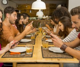 Friends party using mobile phone together Stock Photo 01