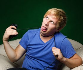 Funny man holding gamepad Stock Photo