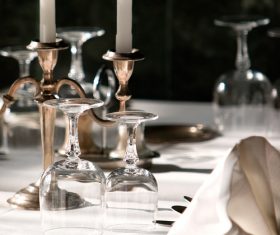 Glass wine glasses and candles on the desktop Stock Photo