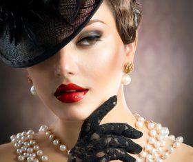 Graceful woman wearing pearl necklace Stock Photo