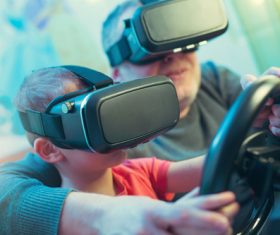 Grandpa and grandson playing games with VR Stock Photo 02