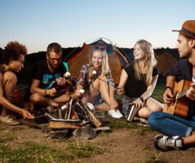 Grilling food on a campfire Stock Photo 01