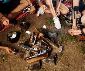 Grilling food on a campfire Stock Photo 02