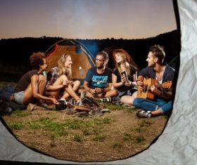 Happy friends camping Stock Photo