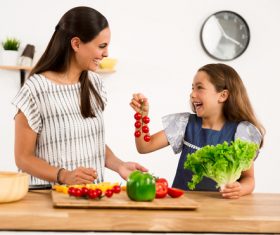 Happy mother and daughter in the kitchen Stock Photo 01