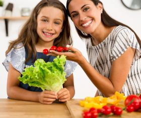 Happy mother and daughter in the kitchen Stock Photo 03