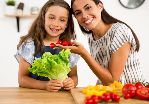 Happy mother and daughter in the kitchen Stock Photo 03