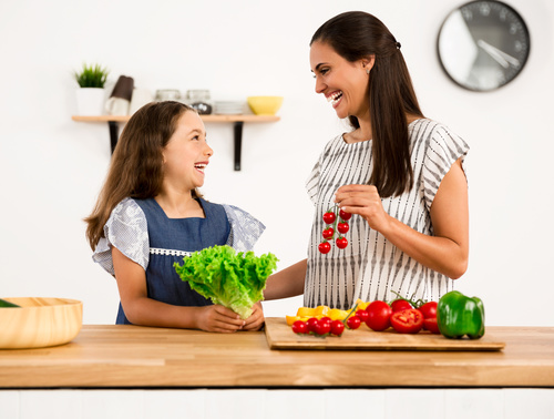 Happy mother and daughter in the kitchen Stock Photo 04