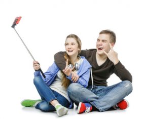 Happy teen boy and girl using a smartphone selfie Stock Photo 01