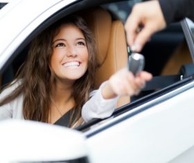 Happy woman buying new car Stock Photo 01