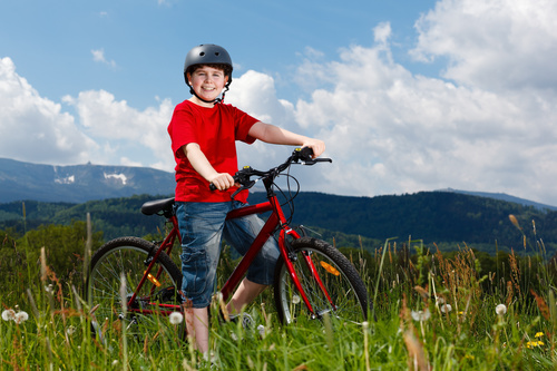 Little boy riding bicycle Stock Photo