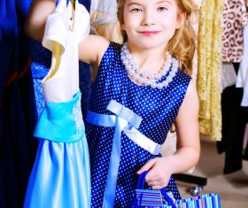 Little girl buying new clothes Stock Photo