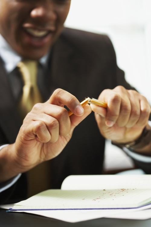 Man break off pencil Stock Photo