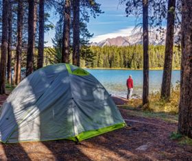 Man camping at the lake Stock Photo